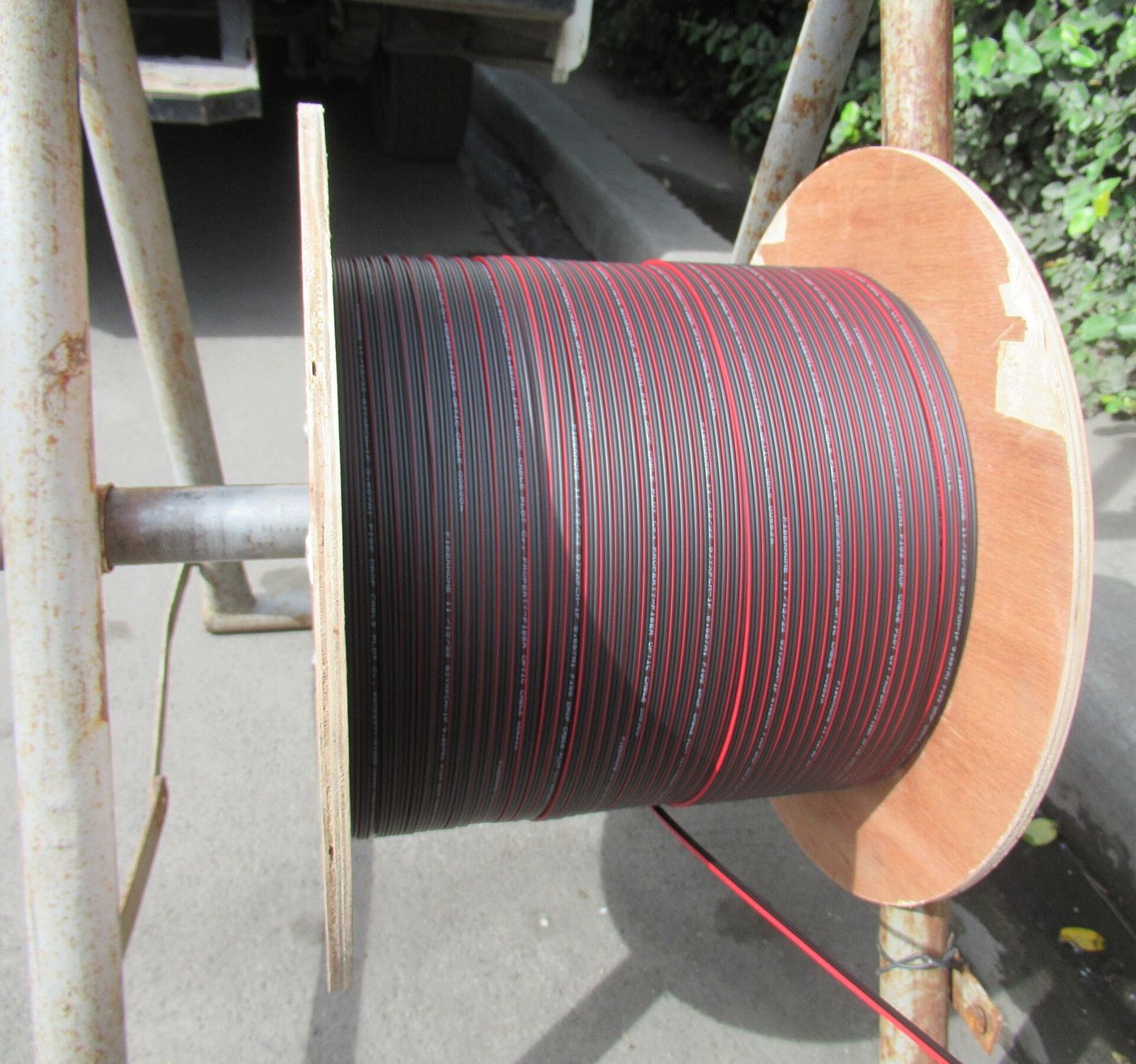 A drum of optical fibre cable on a roadside